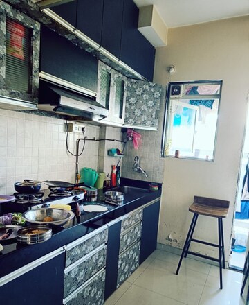 Kitchen in 1 BHK Apartment at Cosmos Orchid, Ghodbunder Road – for Sale