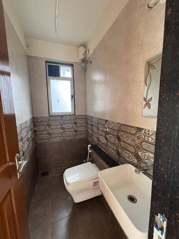 Bathroom in 1 BHK Apartment at Sunteck Maxxworld, Naigaon East – for Rent