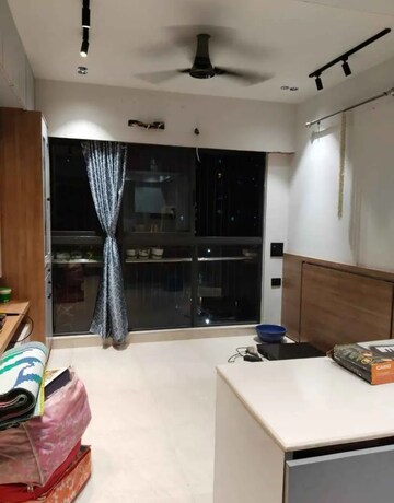 Living Room in 1 BHK Apartment at Lodha Crown Quality Homes, Majiwada – for Rent