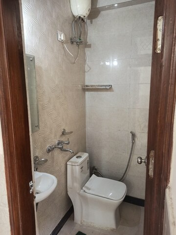 Bathroom in 3 BHK Builder Floor at Freedom Fighters Enclave – for Sale