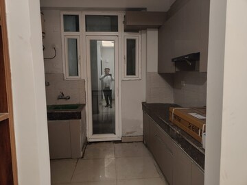 Kitchen in 2.5 BHK Apartment at Sikka Karnam Greens, Sector 143b – for Rent