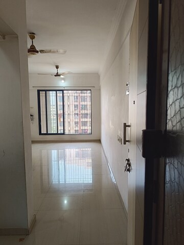 Bathroom in 2 BHK Apartment at Unnati Woods CHS, Kasarvadavali – for Sale