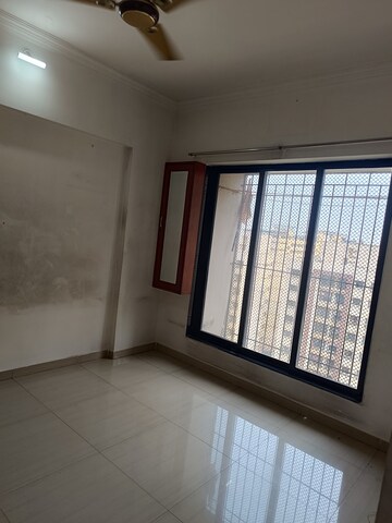 Room in 2 BHK Apartment at Unnati Woods CHS, Kasarvadavali – for Sale