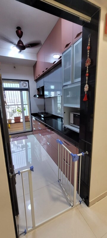 Kitchen in 2 BHK Apartment at Rustomjee Urbania Azziano, Majiwada – for Sale