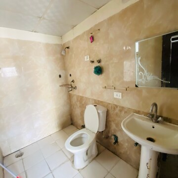 Bathroom in 2.5 BHK Apartment at Aims Golf City, Noida Central – for Rent