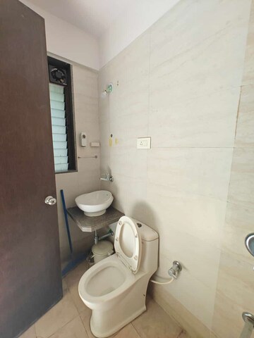 Bathroom in 3 BHK Apartment at Akshar Alvario, Seawoods – for Rent