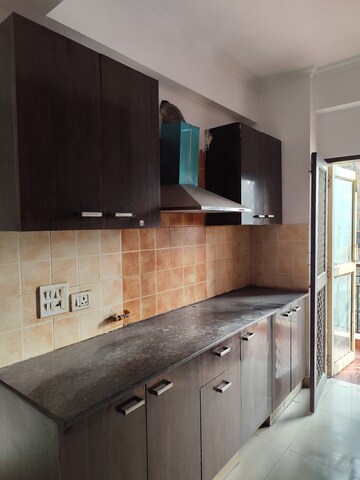 Kitchen in 2.5 BHK Apartment at Aims Golf City, Sector 75 – for Rent