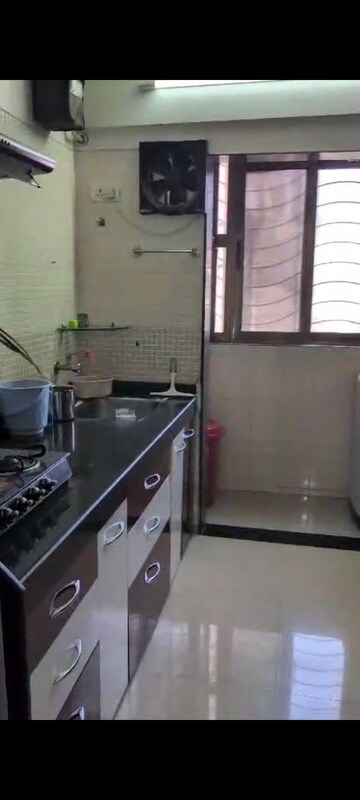 Kitchen in 2.5 BHK Apartment at Sudarshan Sky Garden, Ghodbunder Road – for Rent