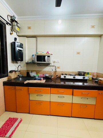 Kitchen in 3 BHK Apartment at T Bhimjyani Neelkanth Woods, Manpada – for Sale