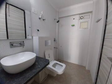 Bathroom in 3 BHK Apartment at Paradigm Business Hermitage Park, Dhakoli Village – for Rent