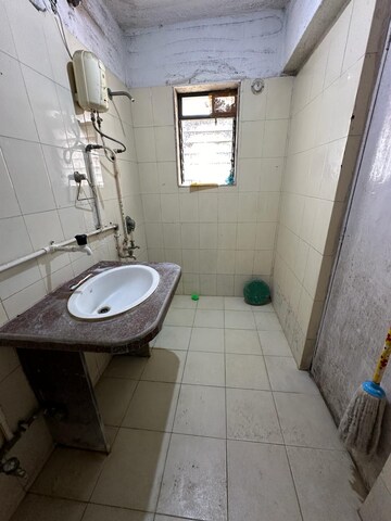 Bathroom in 1 RK Apartment at Royal Palms Garden View, Goregaon East – for Rent