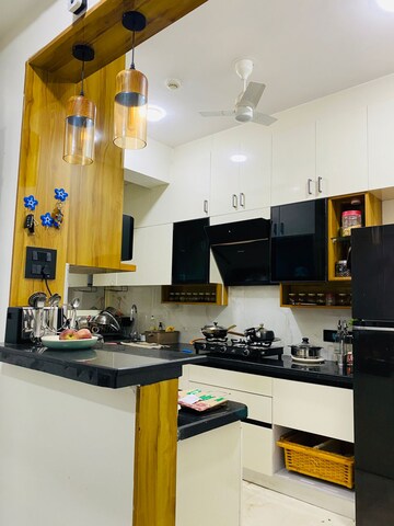 Kitchen in 2 BHK Apartment at Amrapali Eden Park, Sector 50 – for Rent