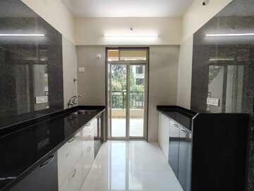 Kitchen in 3 BHK Apartment at Mohan Suburbia Phase 4, Ambernath – for Sale