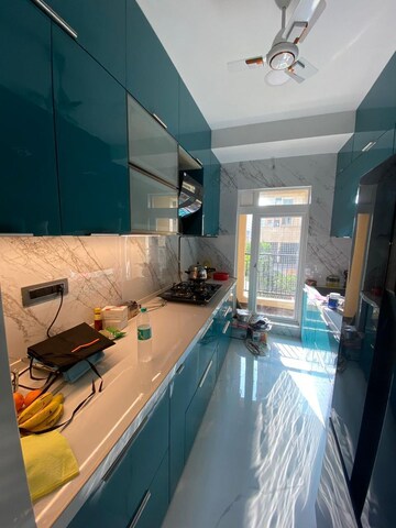 Kitchen in 2 BHK Apartment at Rustomjee Urbania, Majiwada – for Sale