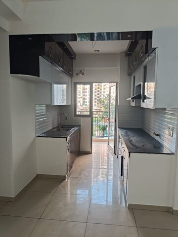 Kitchen in 2 BHK Apartment at Gulshan Bellina, Sector 16 Greater Noida – for Sale