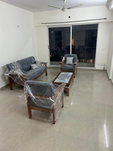 Living Room in 3.5 BHK Apartment at Aims Golf City, Sector 75 – for Rent