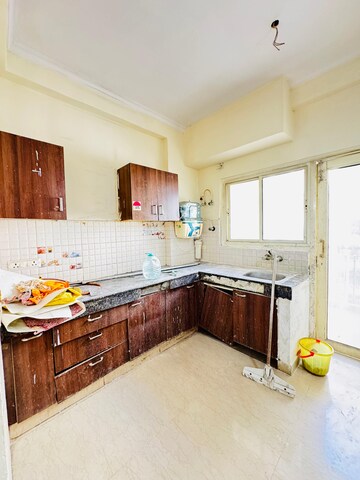 Kitchen in 2.5 BHK Apartment at Aims Golf City, Sector 75 – for Sale