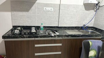 Kitchen in Studio Apartment at Gera World of Joy, Kharadi – for Rent