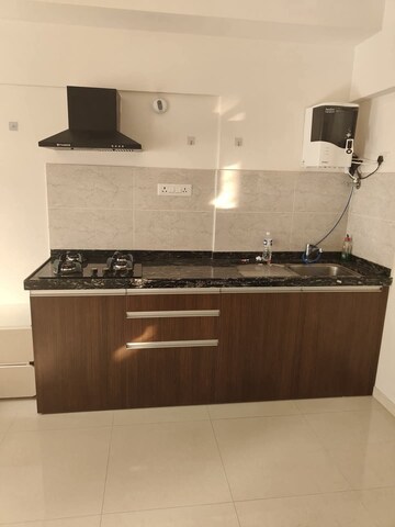 Kitchen in Studio Apartment at Gera World of Joy, Kharadi – for Rent