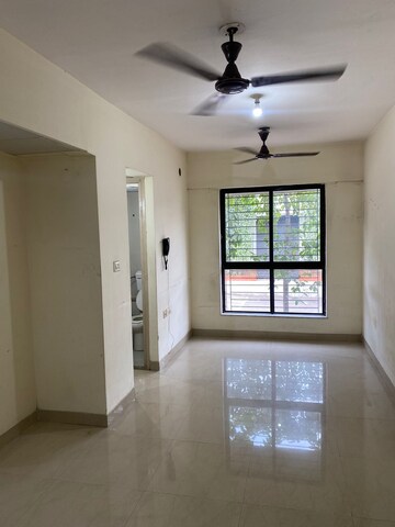 Living Room in 1 BHK Apartment at Lodha Palava Downtown, Dombivli East – for Rent