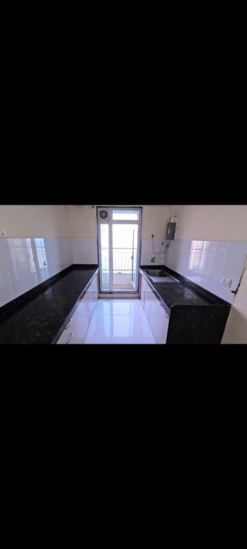 Kitchen in 2 BHK Apartment at Rustomjee Azziano Wing D, Majiwada – for Sale