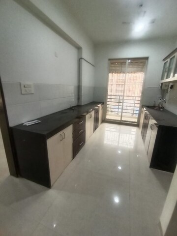 Kitchen in 3 BHK Apartment at Siddhi Siddhi Grandeur, Kharghar – for Rent