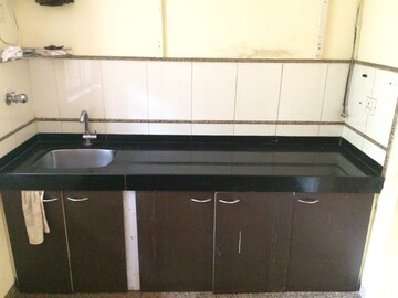 Kitchen in 1 BHK Apartment at Siddhachal Phase 5 CHS Ltd, Vasant Vihar – for Sale