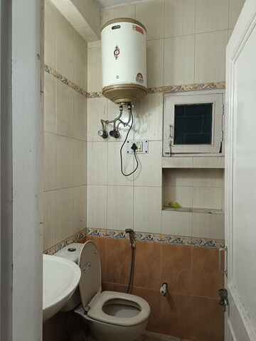 Bathroom in 2 BHK Apartment at Arun Vihar, Sector 29 – for Rent