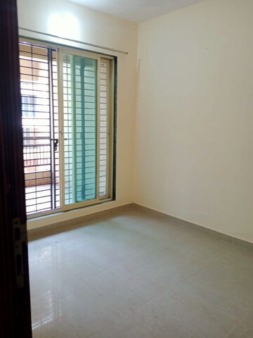 Room in 1 BHK Apartment at Mohan Suburbia, Ambernath West – for Rent
