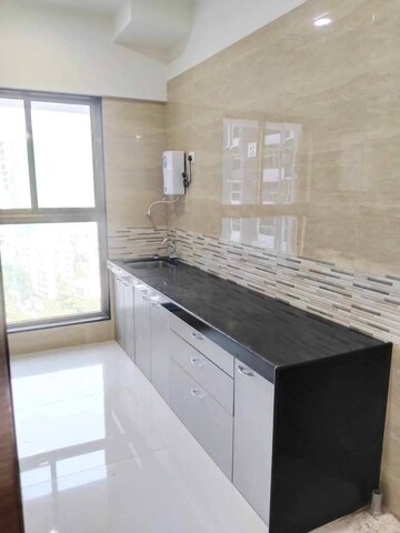 Kitchen in 2 BHK Apartment at Rajesh Raj Infinia, Malad West – for Rent