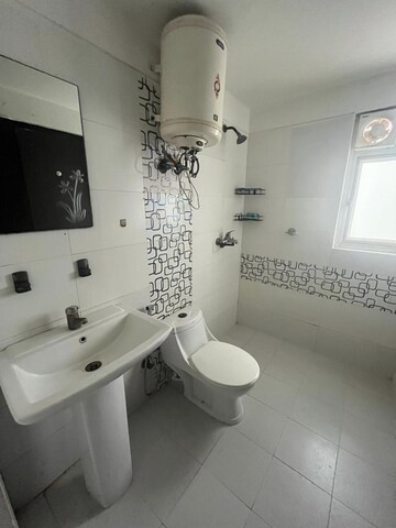 Bathroom in 3 BHK Apartment at Mahagun Mirabella, Sector 79 – for Rent