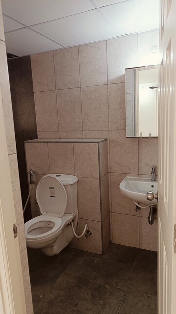 Bathroom in 3 BHK Apartment at Mahaveer Trident, Begur – for Rent