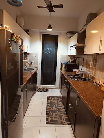 Kitchen in 2 BHK Apartment at Mahagun Moderne, Sector 78 – for Rent