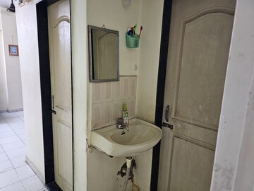Bathroom in 1 BHK Apartment at Alguj CHS, Vasant Vihar – for Sale