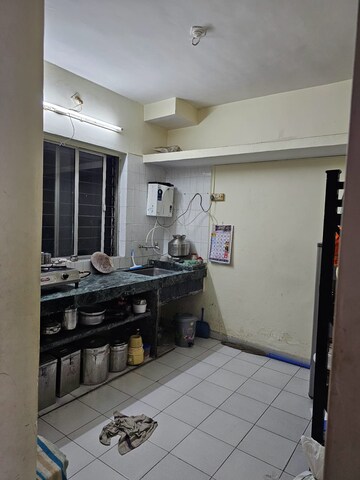 Kitchen in 1 BHK Apartment at Alguj CHS, Vasant Vihar – for Sale