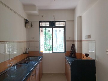 Kitchen in 2.5 BHK Apartment at Lodha Paradise, Majiwada – for Sale