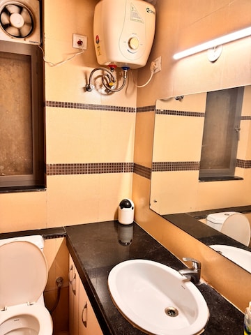 Bathroom in 2 BHK Apartment at Unitech Uniworld Gardens 2, Sector 47 – for Rent
