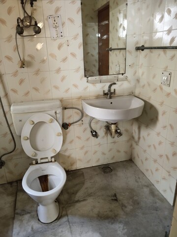 Bathroom in 4 BHK Apartment at Rama Krishna Apartment, Sector 46 – for Sale