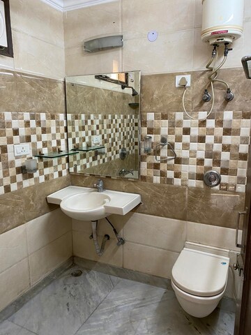 Bathroom in 2 BHK Builder Floor at Paschim Vihar – for Rent