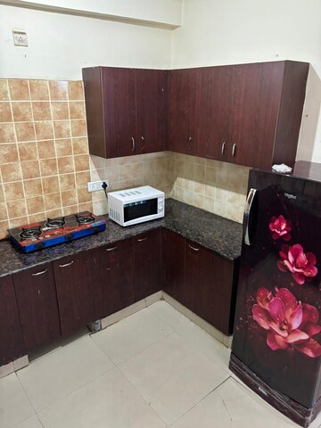 Kitchen in 2 BHK Apartment at Aims Golf City, Sector 75 – for Rent