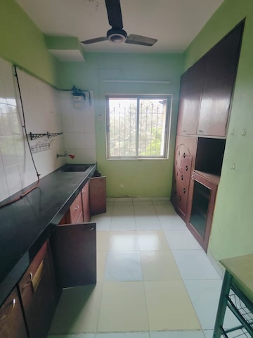 Kitchen in 1 BHK Apartment at Happy Valley, Manpada – for Rent