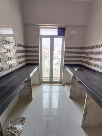 Kitchen in 1 BHK Apartment at Shivneri CHS Majiwada, Majiwada – for Rent