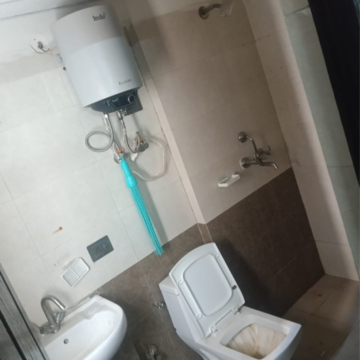 Bathroom in 2.5 BHK Apartment at Gardenia Golf City, Noida Central – for Rent