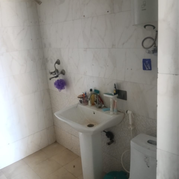 Bathroom in 2.5 BHK Apartment at Gardenia Golf City, Noida Central – for Rent