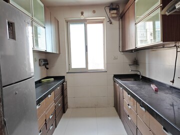 Kitchen in 2.5 BHK Apartment at Bhimjyani Verraton, Manpada – for Rent