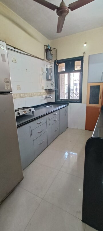 Kitchen in 2 BHK Apartment at Puranik Swapna Dhara, Ghodbunder Road – for Rent