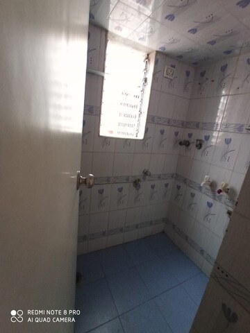 Bathroom in 2 BHK Apartment at RNA Broadway Avenue, Mira Road – for Rent