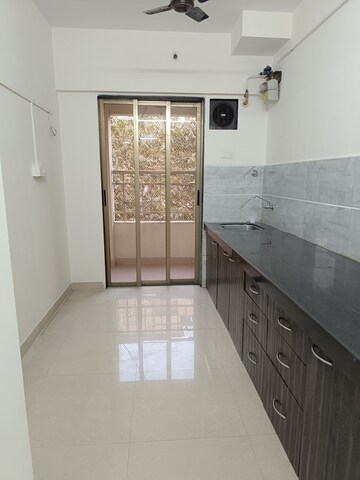 Kitchen in 2 BHK Apartment at Varun Garden, Ghodbunder Road – for Rent