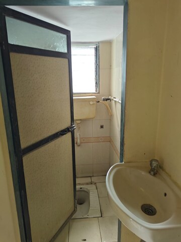 Bathroom in 2 BHK Apartment at Shiv Ganga Smruti CHS, Ambernath East – for Sale