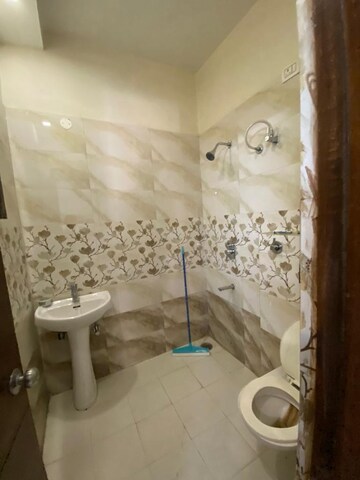 Bathroom in 3 BHK Apartment at MP Metro Towers, Dhakoli Village – for Rent